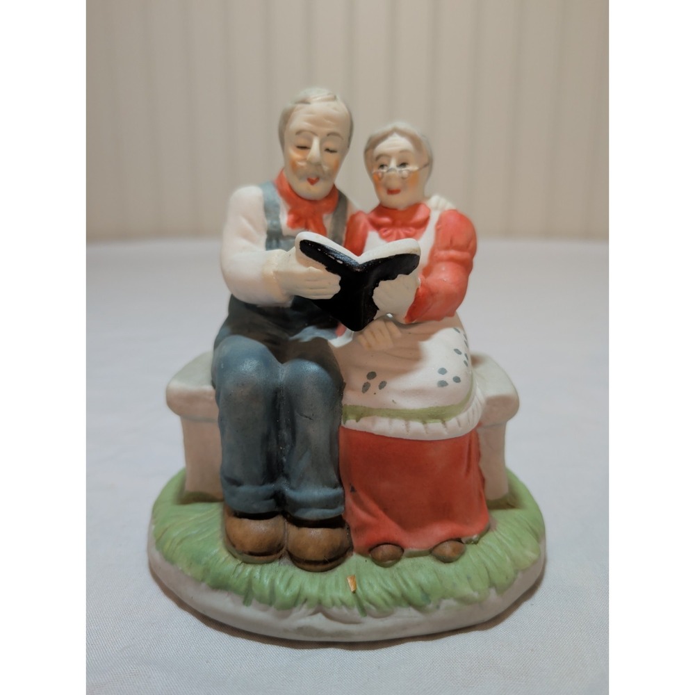 Vintage Bisque Porcelain Elderly Couple on Bench Reading Book Figurine 1988